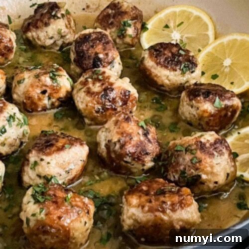 Chicken Piccata Meatballs in a skillet.