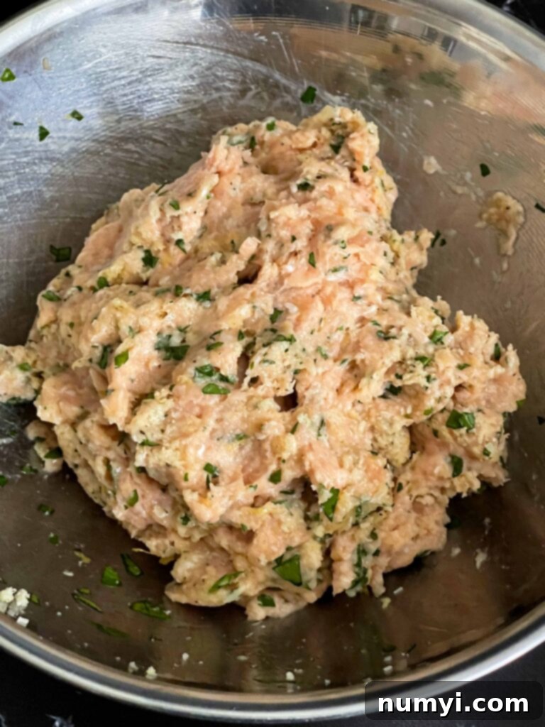 Chicken Piccata Meatballs mixture combined in a mixing bowl.