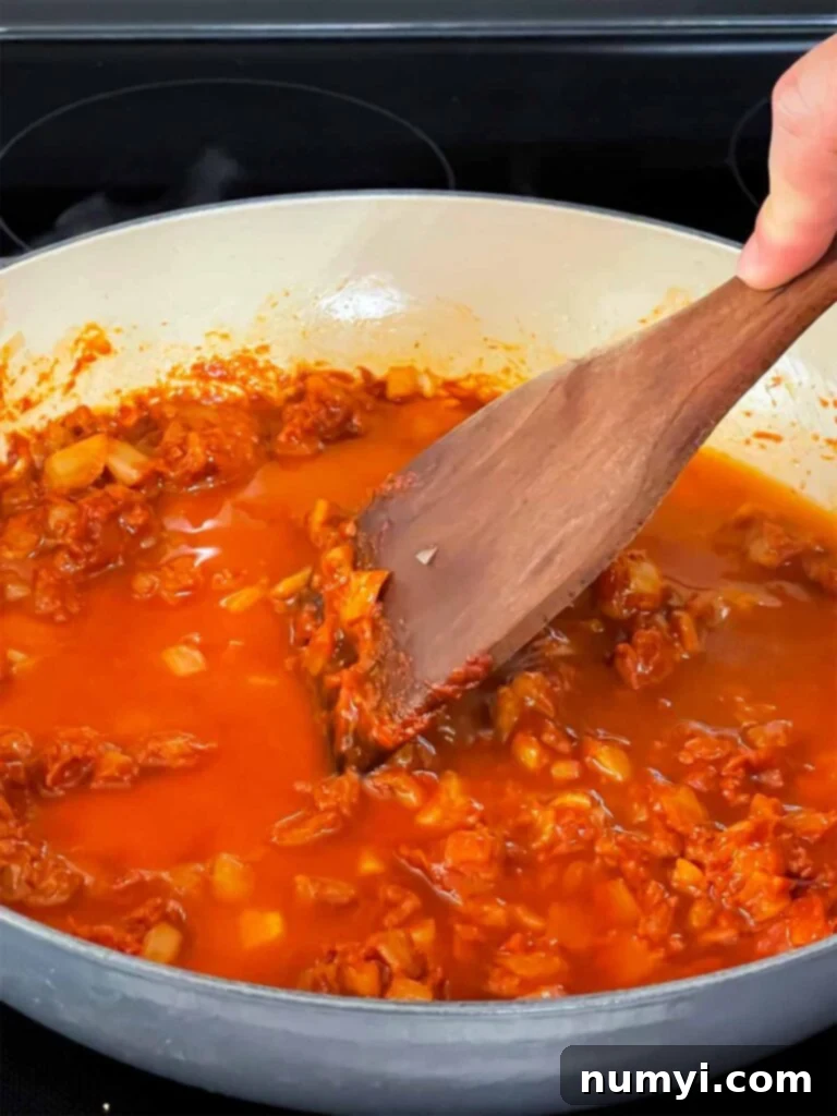 Vodka sauce cooking in a skillet.