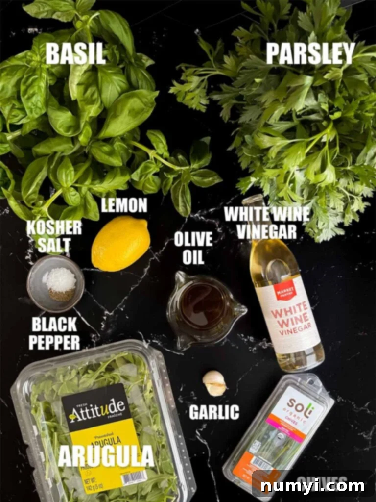 Assortment of fresh herbs and ingredients for the vibrant vinaigrette, including parsley, basil, arugula, chives, garlic, and lemon.