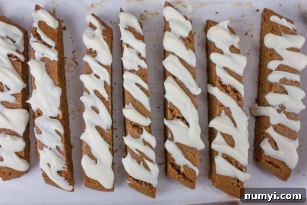 Gingerbread biscotti on a baking sheet.