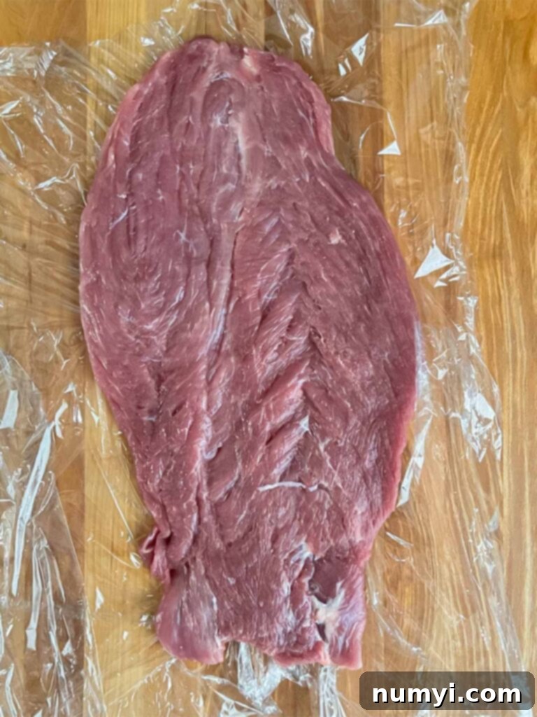Flattened and butterflied pork tenderloin, ready for pounding.