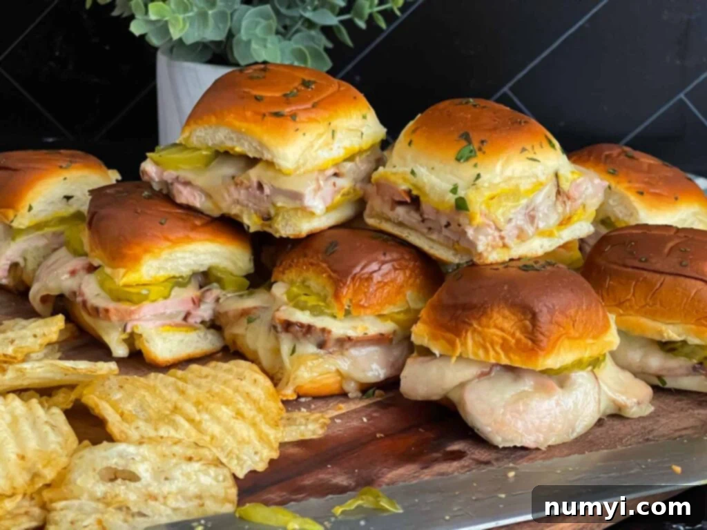 Flavorful grilled pork tenderloin Cuban sliders arranged on a platter, ready to serve.