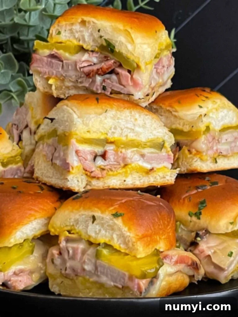 Roll-cut pork tenderloin Cuban sliders, perfect for using leftover smoked pork loin.