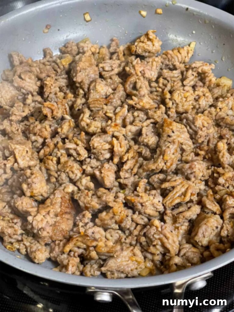 Hearty Italian Sausage Calzone 12 Fully cooked and crumbled Italian sausage in a skillet, seasoned and ready for use as a calzone filling.