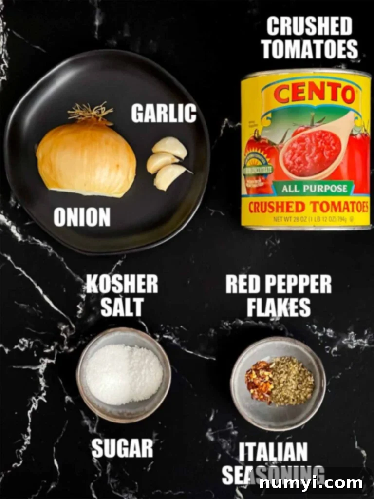 Hearty Italian Sausage Calzone 4 Various dipping sauce ingredients laid out, including a can of crushed tomatoes, garlic, onion, and spices, to accompany a calzone.