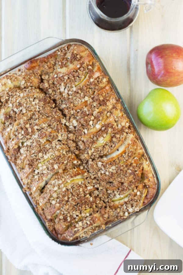 Overnight Apple Cinnamon French Toast Bake 4 an overhead photo of a baking dish full of apple french toast with a streusel topping