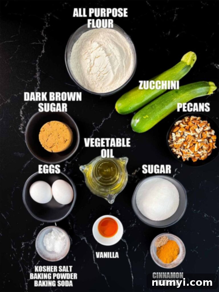 Moist Zucchini Bread 3 Zucchini bread recipe ingredients on a dark surface.