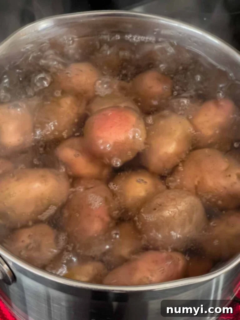 potatoes boiling in a pan.
