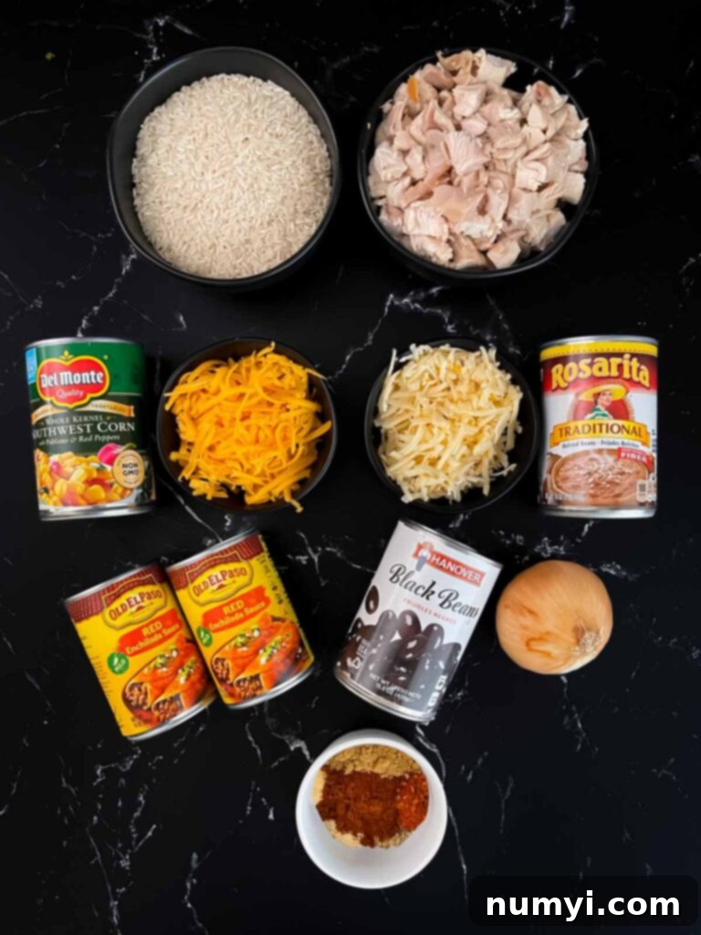Various fresh ingredients for Chicken Enchilada Rice Casserole spread out on a counter.