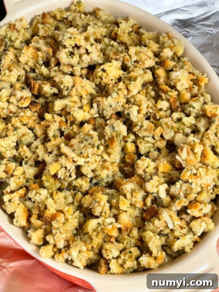 Unbaked Chicken Stuffing Casserole in a baking dish, topped with prepared stuffing.