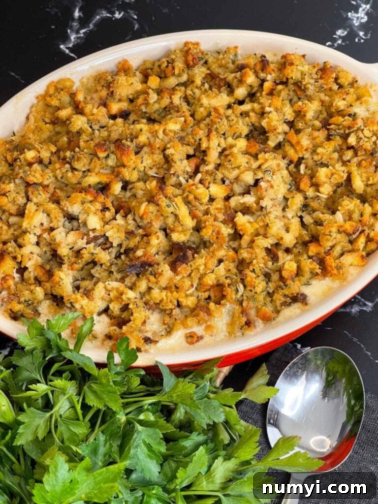 Baked Chicken Stuffing Casserole in a baking dish, with a perfectly crispy and golden-brown topping.