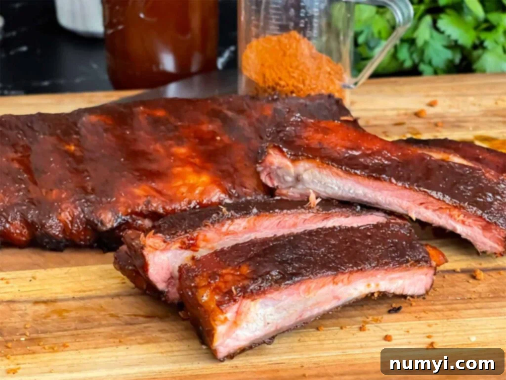 Kansas City style ribs, glistening with barbecue sauce, ready to be served.