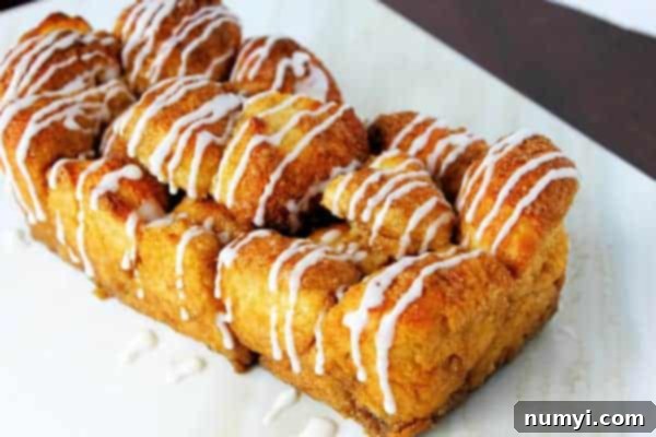 cinnamon sugar monkey bread with icing sugar glaze, close up of the full loaf
