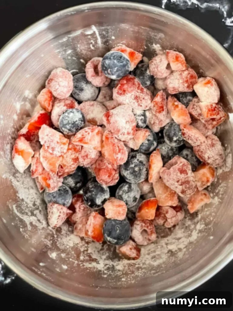Diced mixed berries coated with flour.