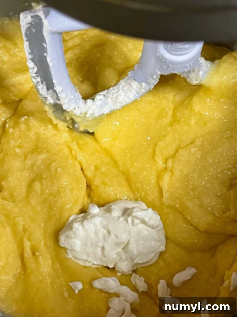 Pound cake batter being made, showing the smooth consistency after mixing.