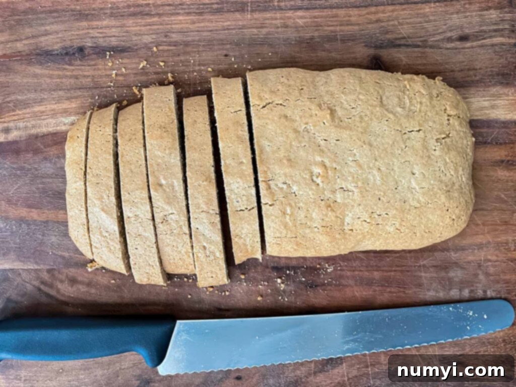 Cutting chai biscotti into cookies.