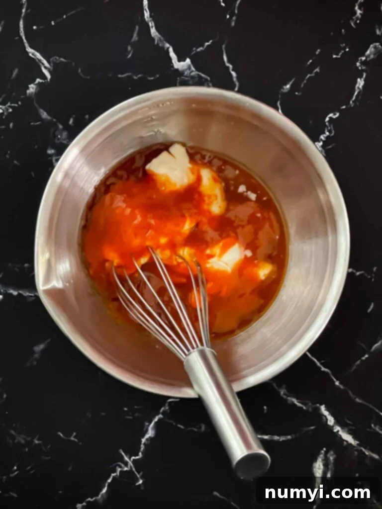Ingredients for bang bang sauce in a bowl.