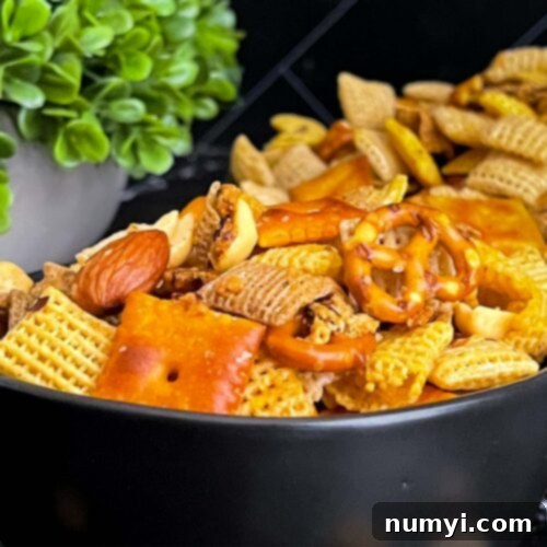 Firecracker Chex Mix in a dark bowl.