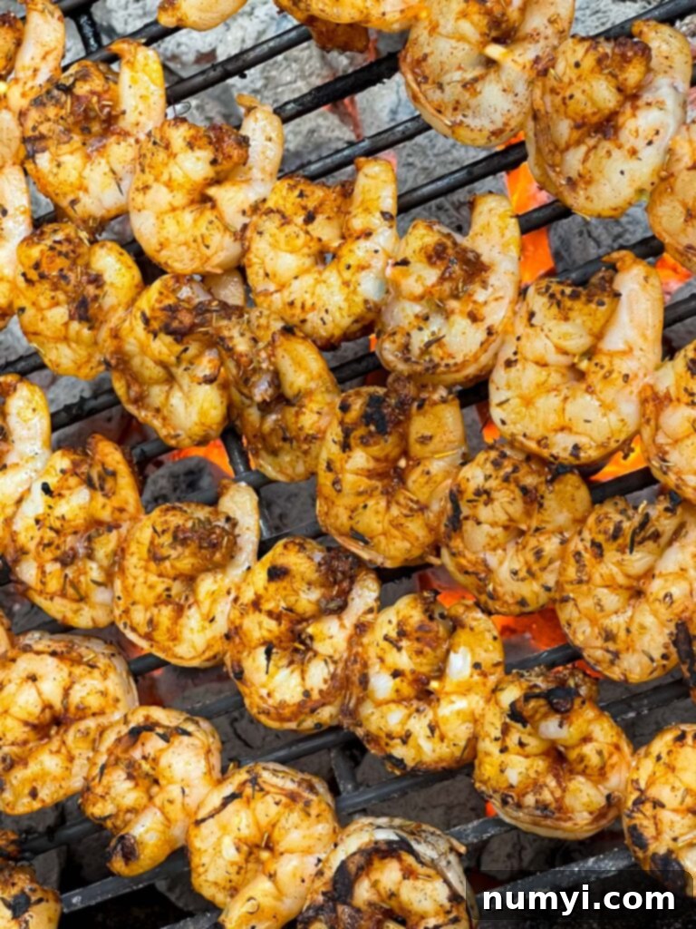Fresh Grilled Shrimp and Corn Salad 13 Shrimp cooking on a hot grill, turning pink and opaque.