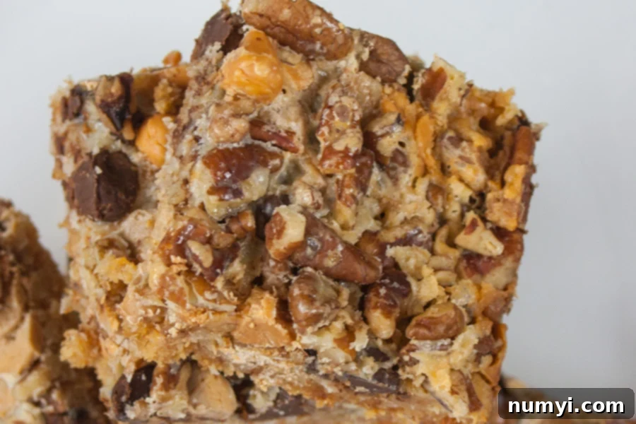 Close-up of a delicious Hello Dolly cookie showing its rich layers.