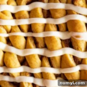 Overhead view of pumpkin twists with cream cheese frosting drizzled over them.