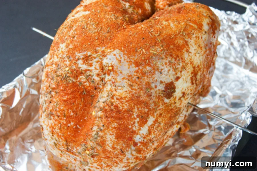 Homemade Cajun Turkey Deli Meat - turkey breast on a foil lined roasting pan