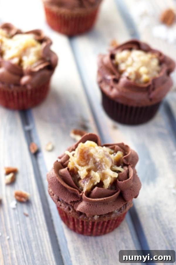 German Chocolate Cupcakes 4 Chocolate cupcakes covered with chocolate frosting and caramel coconut pecan icing, ready to be enjoyed.
