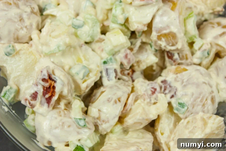 Easy Bacon Potato Salad in a large glass bowl.