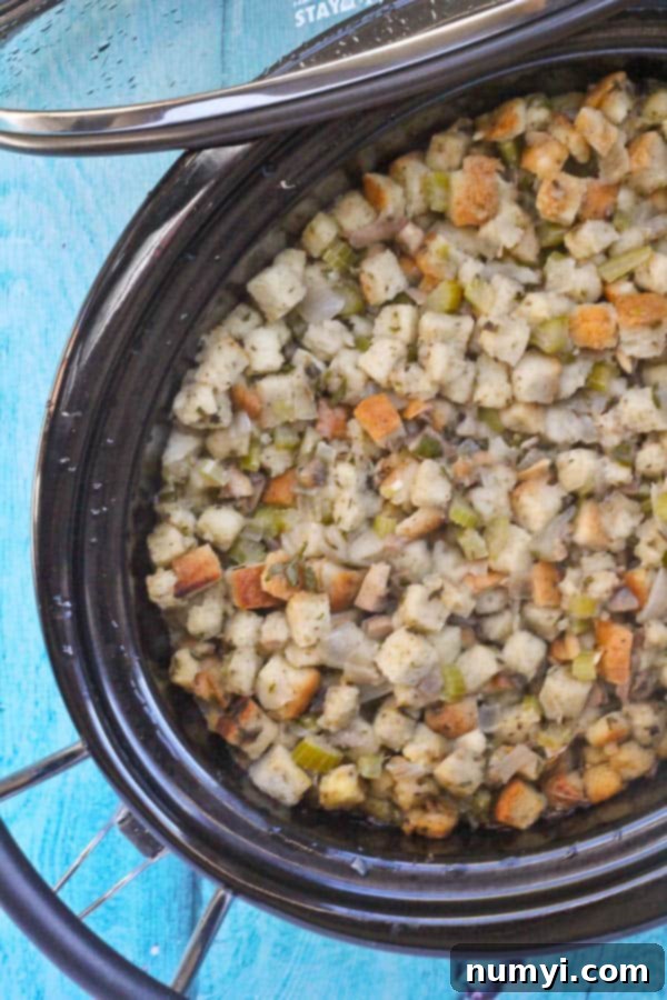 Convenient Slow Cooker Stuffing, a moist and flavorful Thanksgiving side dish cooked hands-free, freeing up oven space during the busy holiday season.