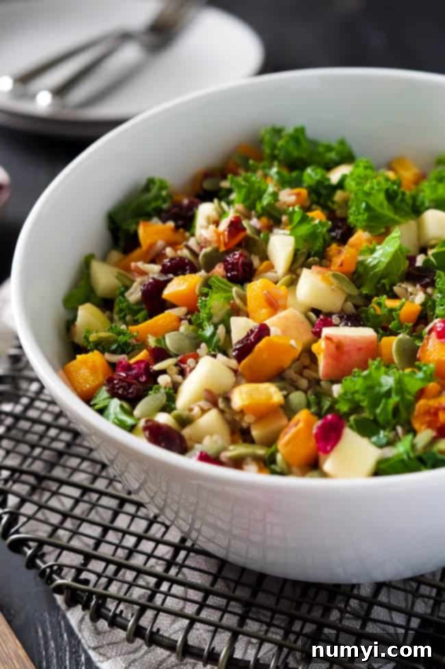 A refreshing Fall Harvest Salad with Apple Cider Vinaigrette, featuring seasonal ingredients like crisp apples, nuts, and greens, perfect for a balanced Thanksgiving menu.