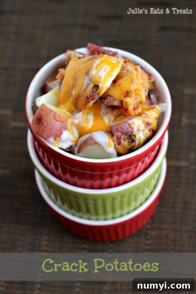 Irresistible Crack Potatoes, a cheesy, creamy, and savory baked potato dish from Julie's Eats and Treats, perfect for an indulgent Thanksgiving side.