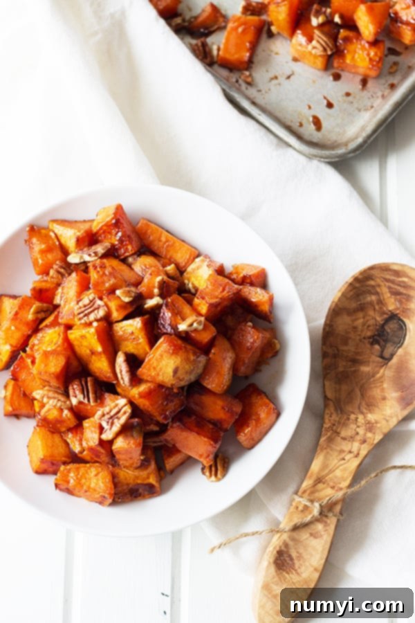 Maple Roasted Sweet Potatoes - these are lightly sweetened with maple syrup, spiced with cinnamon and have an optional crunch from pecans, YUM! | countrysidecravings.com
