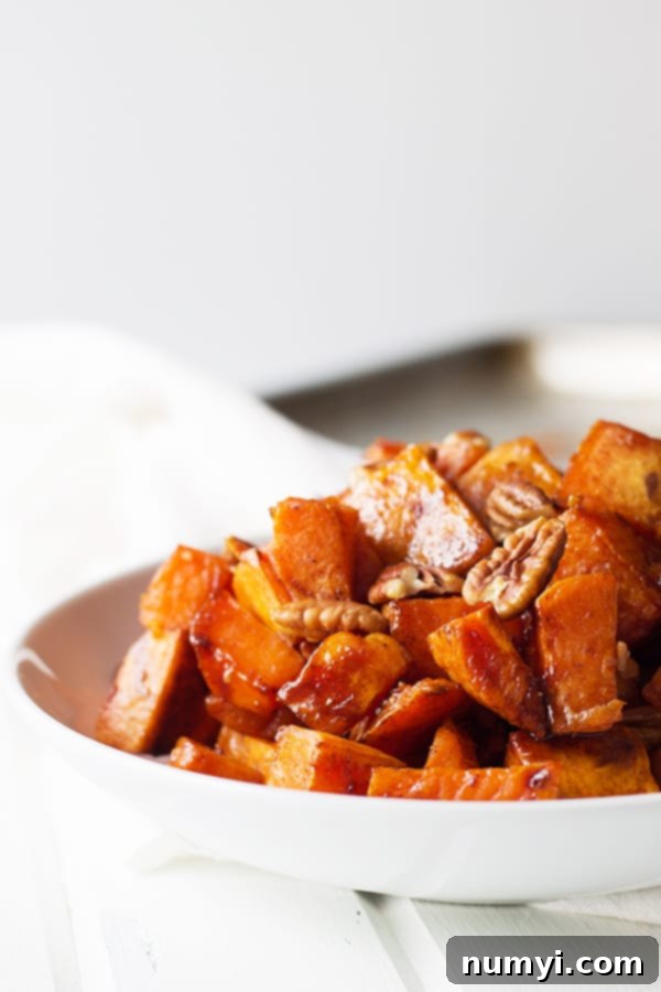 Maple Roasted Sweet Potatoes - these are lightly sweetened with maple syrup, spiced with cinnamon and have an optional crunch from pecans, YUM! | countrysidecajackings.com