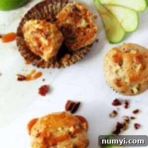 Praline Apple Pecan Muffins, golden brown and enticing.