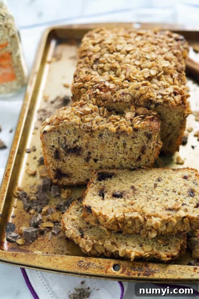 Rich Dark Chocolate Chunk Banana Bread with Oatmeal Streusel, a comforting and indulgent Christmas treat.