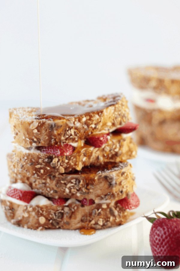 Decadent Strawberry and Cream Cheese Stuffed French Toast, a luxurious Christmas breakfast.