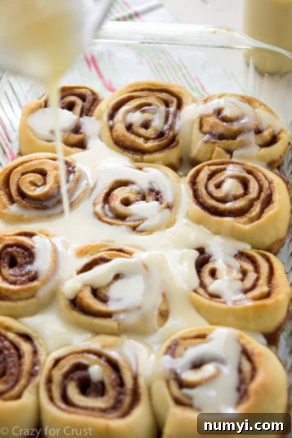 Sweet and festive Eggnog Cinnamon Rolls, a delightful Christmas breakfast treat.