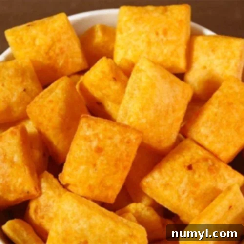Whip Up Your Own Spicy Cheese Crackers 9 Spicy Cheese Crackers in a white bowl.