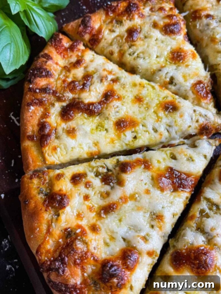 Homemade pesto and cheese pizza using the easy homemade pizza dough.