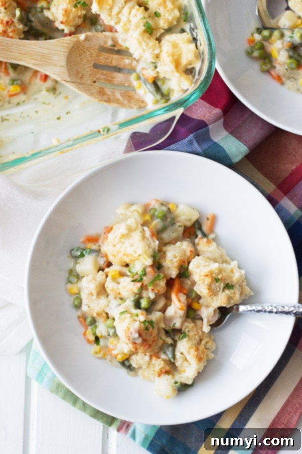 Chicken Pot Pie in a casserole dish and spooned into bowls