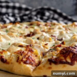 The Ranch Hand's Special 8 Close up of pizza crust showing the lightly browned melty cheese.
