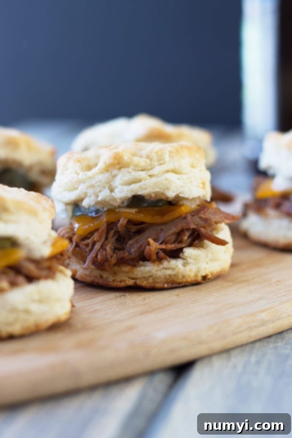 BBQ Pulled Pork Biscuit Sliders - perfect little sandwiches with smokey pulled pork, melted cheddar and Dijon mustard.