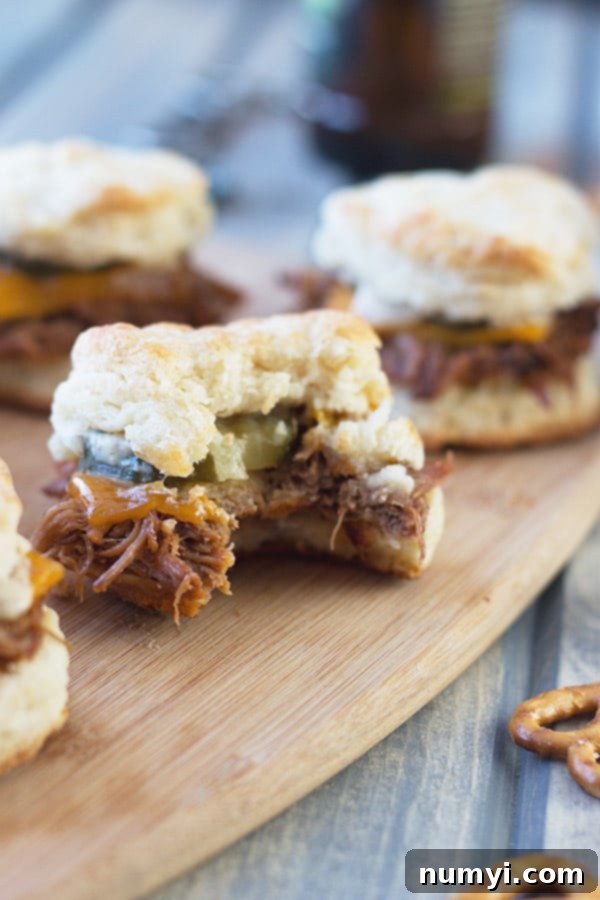 A close-up of the delicious layers of a BBQ Pulled Pork Biscuit Slider.