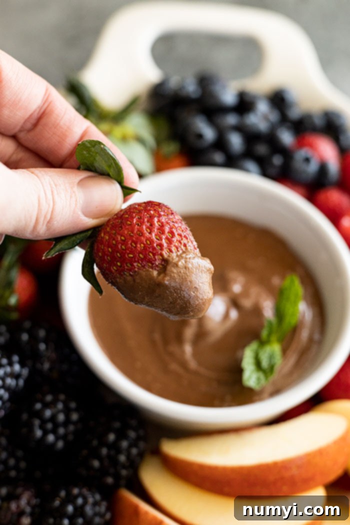 Rich Chocolate Cream Cheese Fruit Dip 6 Strawberry dipped into the fruit dip.