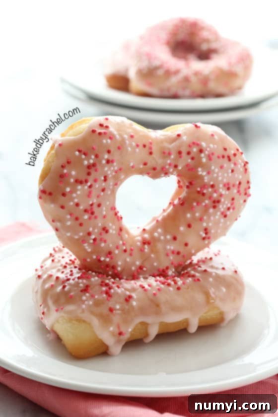 Sweet and charming Strawberry Glazed Valentine Donuts, a perfect romantic breakfast treat