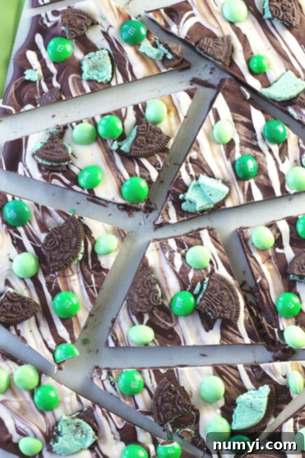 Close-up of St. Patrick's Day Bark with missing cookie tops, showcasing the delicious chocolate and mint Oreo pieces - a tempting holiday dessert.