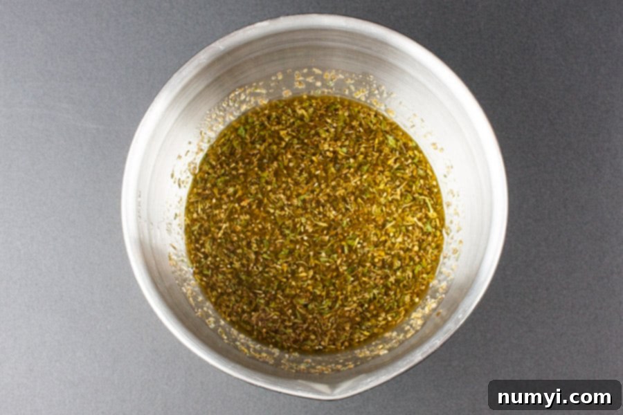 Marinade mixed in a metal bowl.