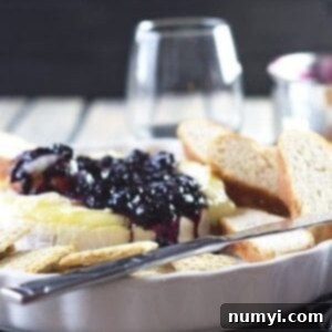 Sweet & Savory Blueberry Brie 5 Recipe card image of Blueberry Baked Brie with the blueberry sauce visible.