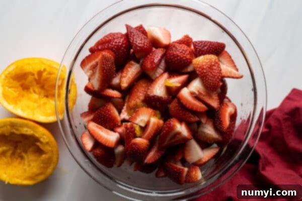 Overhead view of macerating strawberries.